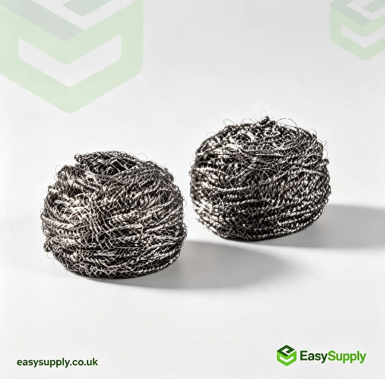 Two stainless steel spiral scourers